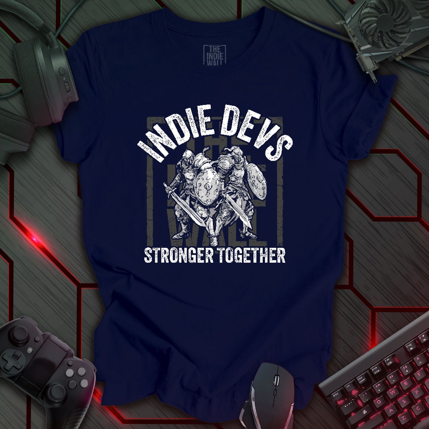 stylized black and white illustration of two armored fantasy warriors standing in front of a large faded Indie Wall brand logo. Bold distressed arched text above reads "INDIE DEVS". Bold text below the image reads "STRONGER TOGETHER". Navy blue background.