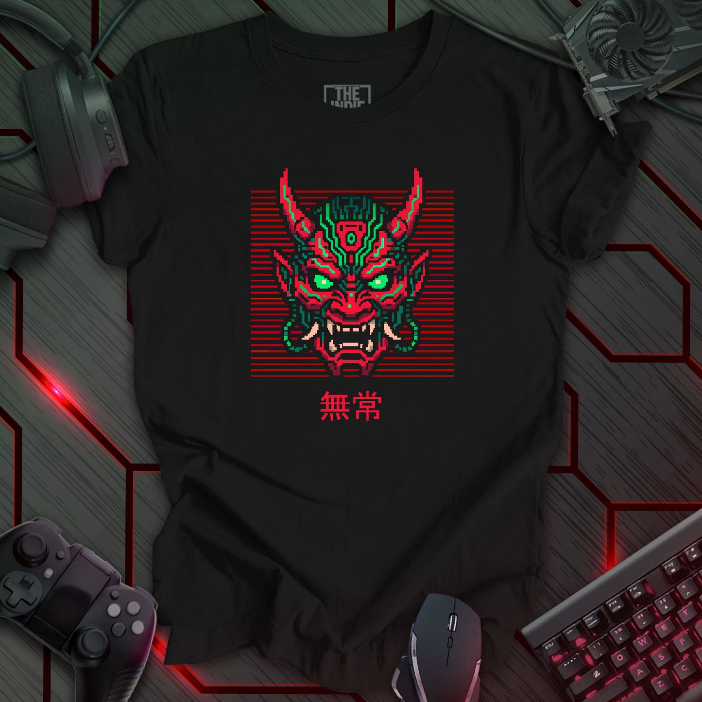 Green and red pixel art cyber oni mask with glowing eyes – retro gaming black t-shirt design featuring Japanese kanji for impermanence