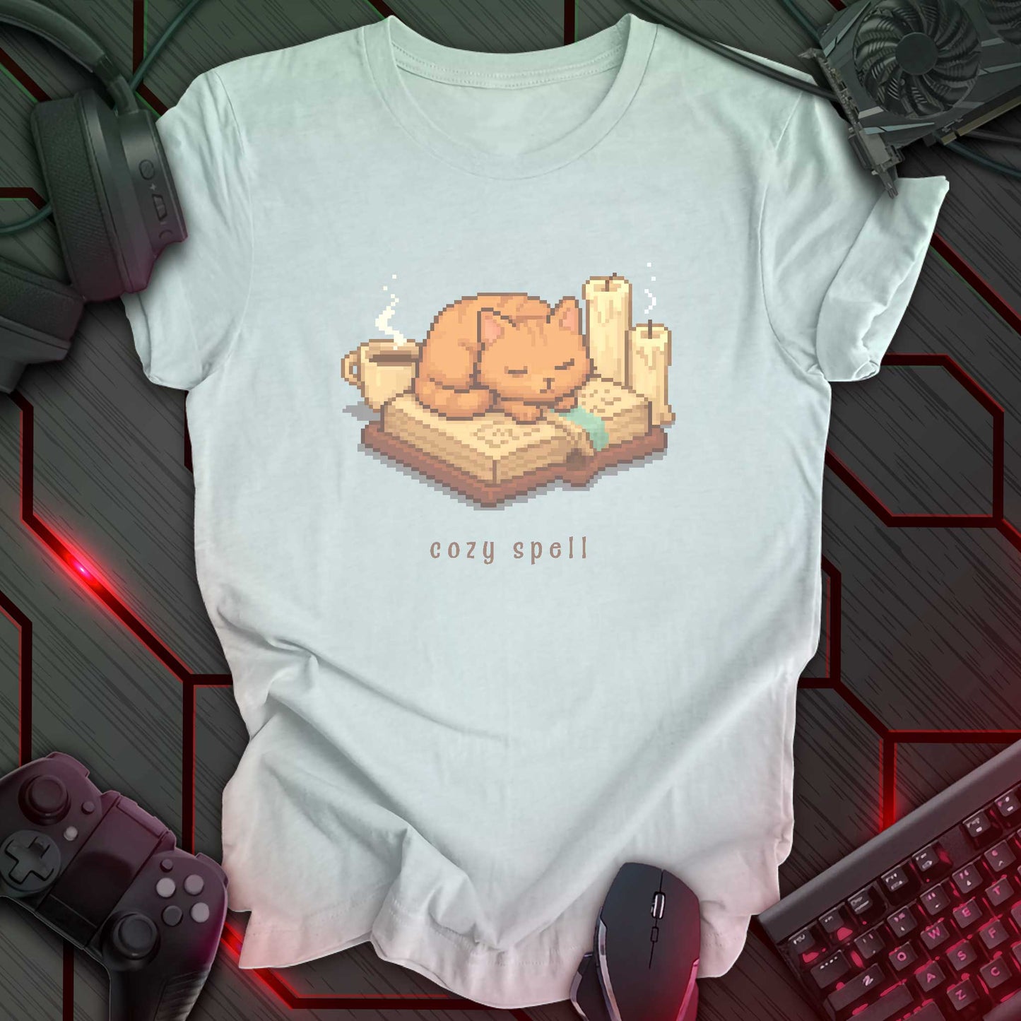 Pixel art orange cat sleeping on a book with candles and a coffee mug, under the text "cozy spell" in soft cozy gamer style. Heather Ice Blue background.