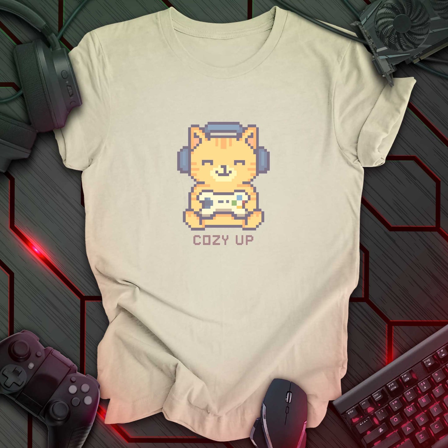 Pixel art orange cat wearing headphones and holding a game controller above the words "Cozy Up" in cozy gamer kawaii style. Natural color background.