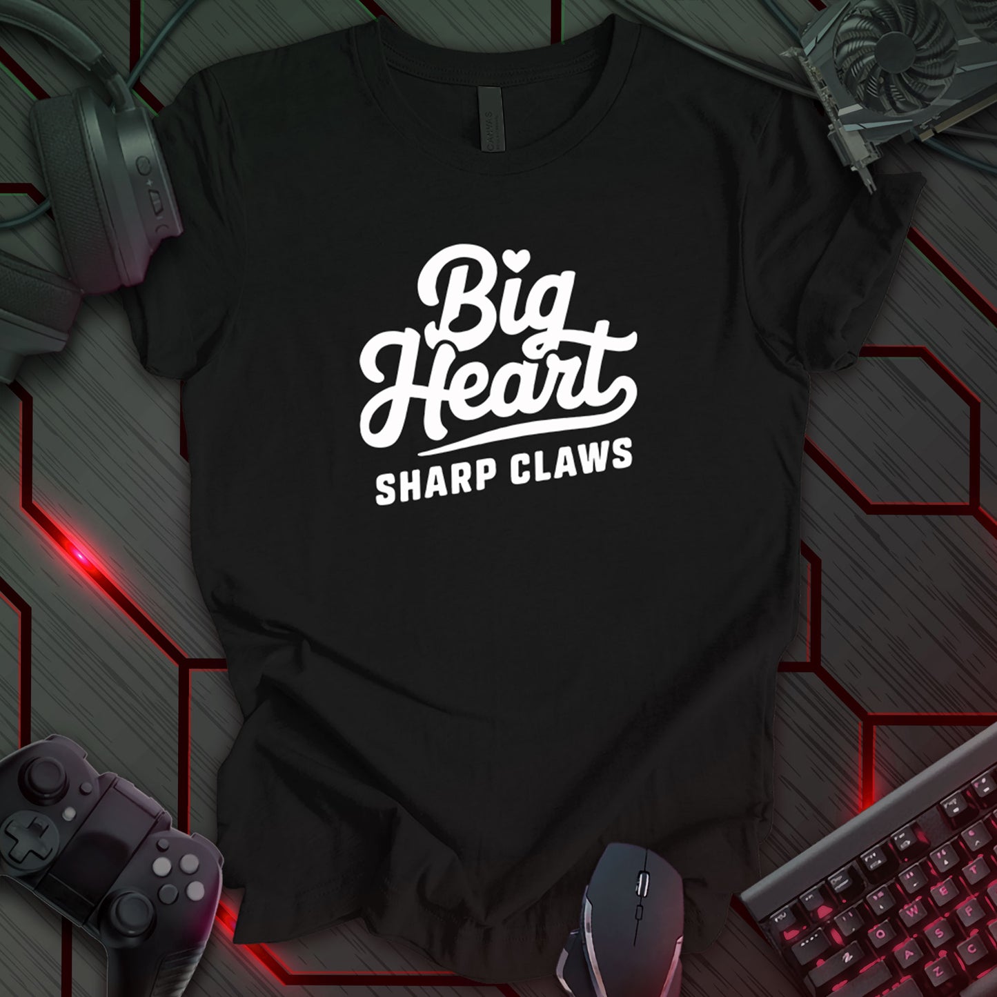 Black gaming t-shirt featuring bold white cursive text reading 'Big Heart Sharp Claws,' designed with a clean, modern typographic style.