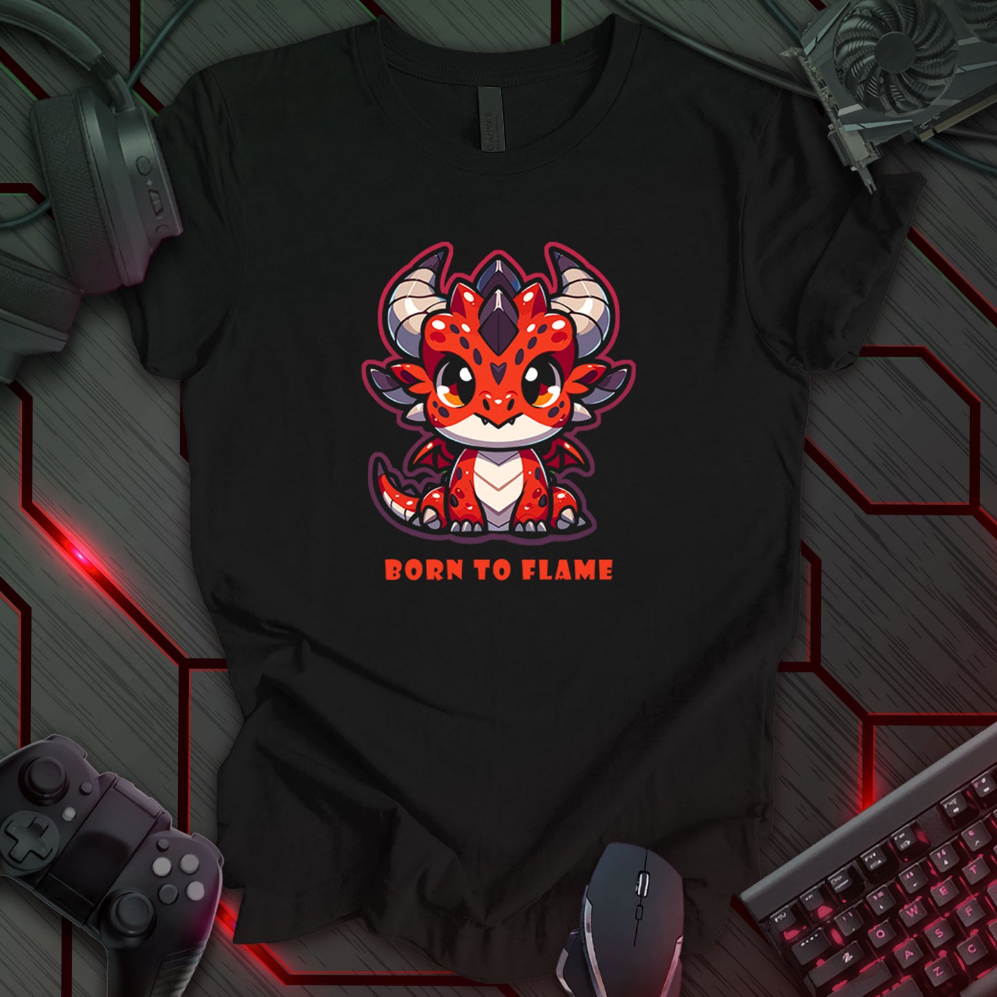 Black gaming t-shirt featuring a Kawaii-style red baby dragon with large eyes, horns, and a playful design. Below the dragon, bold red text reads 'Born To Flame' for a dynamic and fun look.