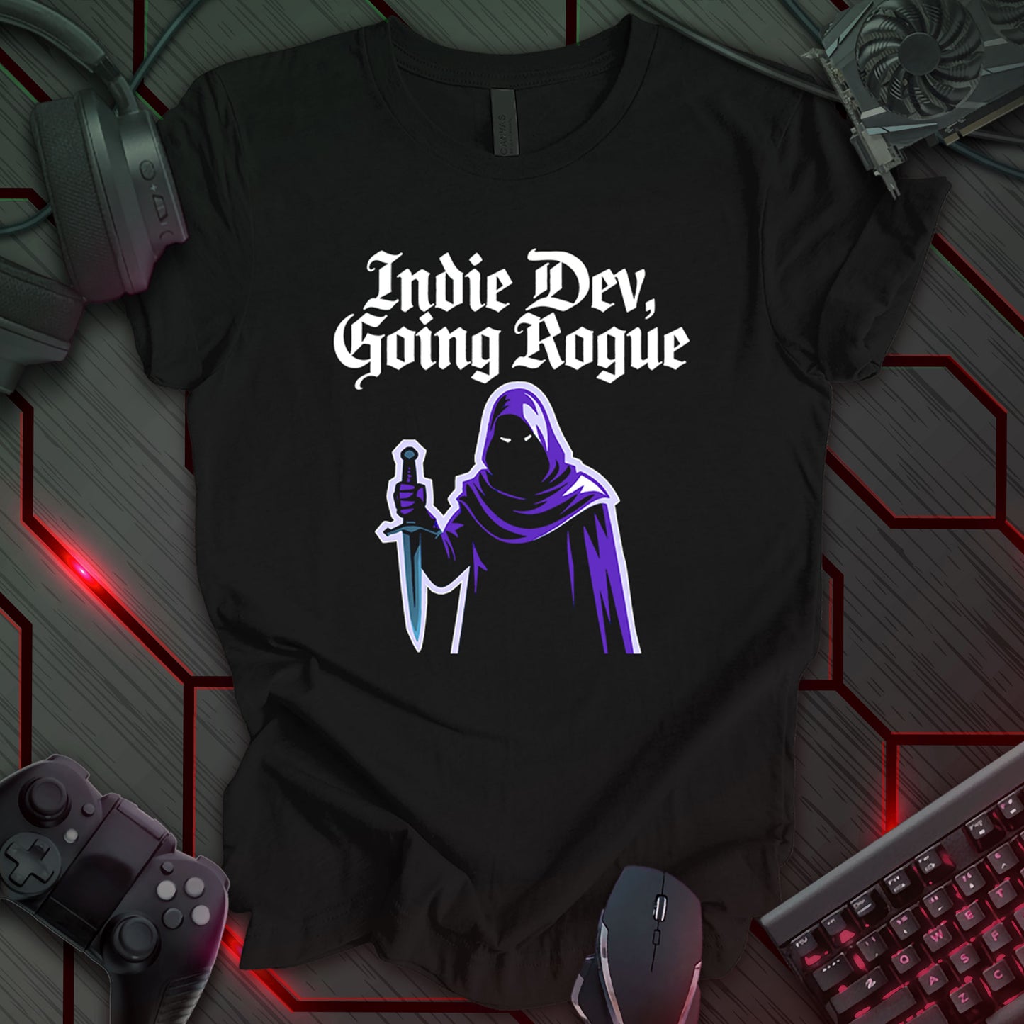 T-shirt design with "Indie Dev, Going Rogue" in stylized text above a hooded figure holding a sword, on a black background. Design for indie game developers and fans, blending coding with fantasy RPG themes. Keywords: indie dev shirt, game developer tee, coding apparel, RPG t-shirt, fantasy gaming, developer gift, geeky clothing, indie game design, rogue class.