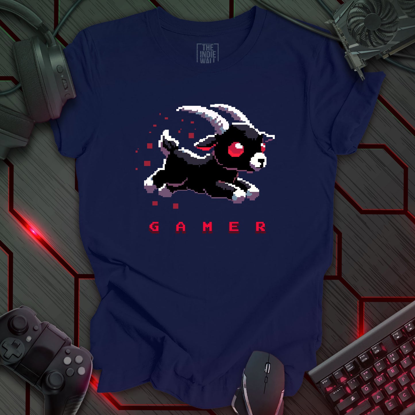 leaping pixel art black baby goat with large white horns, large red eyes trailed by red pixels. The single word "GAMER" written in a pixel art font beneath the image. Navy blue background.