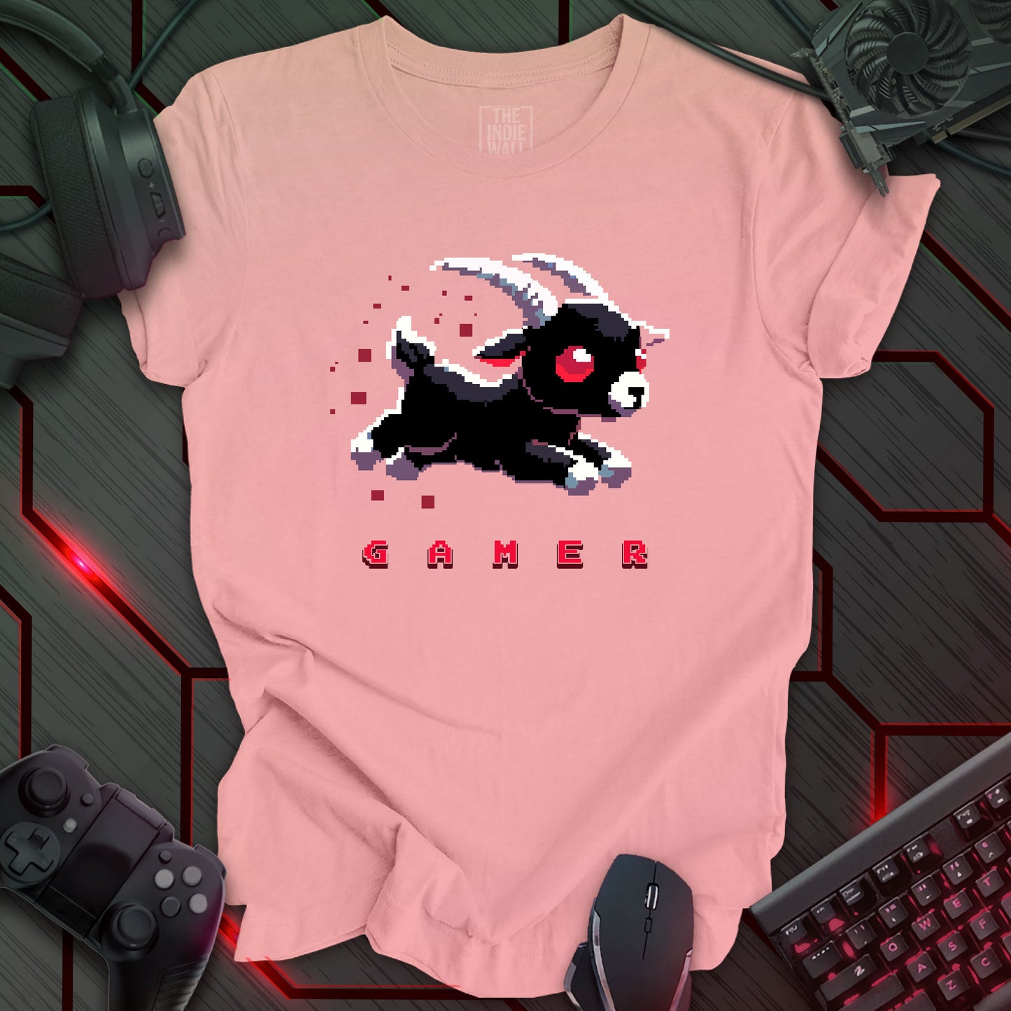 leaping pixel art black baby goat with large white horns, large red eyes trailed by red pixels. The single word "GAMER" written in a pixel art font beneath the image. Light pink background.
