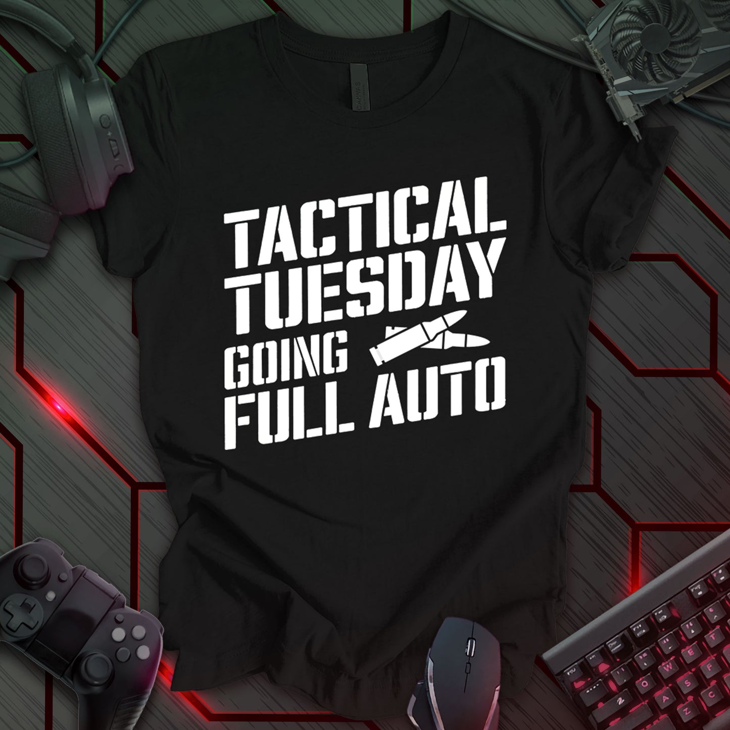 Graphic design featuring the phrase 'TACTICAL TUESDAY' in a bold, stencil-style font at the top, followed by 'GOING' and 'FULL AUTO' in the same font. Between 'TUESDAY' and 'GOING' is an illustration of a bullet. All text and the bullet illustration are white against a black background. This is a design with a tactical or military theme, featuring a bold statement and a bullet image.