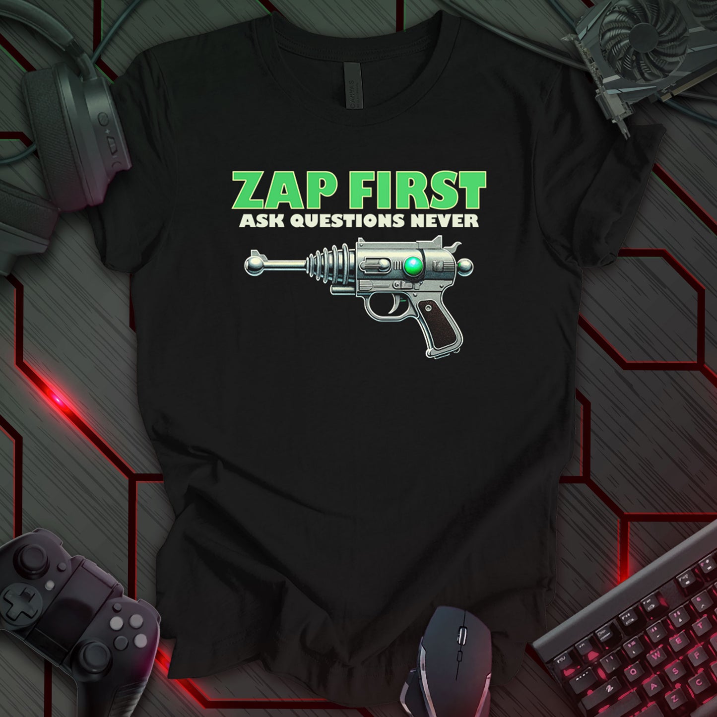 This t-shirt design, created for those with a humorous and rebellious spirit, features the phrase 'ZAP FIRST ASK QUESTIONS NEVER' in green, bold lettering above a detailed illustration of a vintage, silver ray gun on a black background. This design appeals to fans of retro science fiction and those who appreciate a bold, unconventional statement.