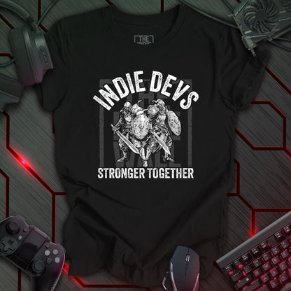 stylized black and white illustration of two armored fantasy warriors standing in front of a large faded Indie Wall brand logo. Bold distressed arched text above reads "INDIE DEVS". Bold text below the image reads "STRONGER TOGETHER". Black background.