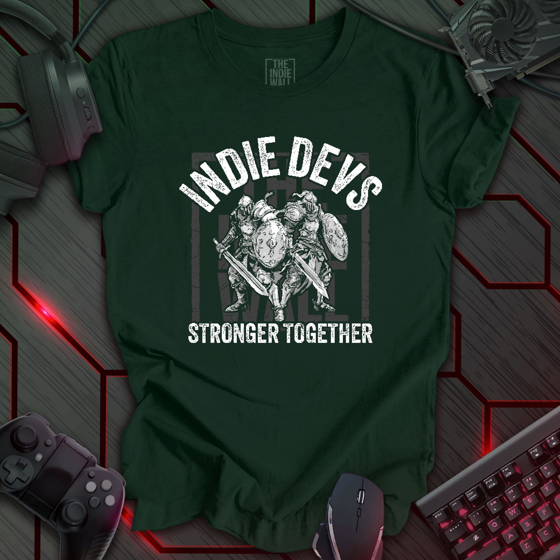 stylized black and white illustration of two armored fantasy warriors standing in front of a large faded Indie Wall brand logo. Bold distressed arched text above reads "INDIE DEVS". Bold text below the image reads "STRONGER TOGETHER". Forest green background.