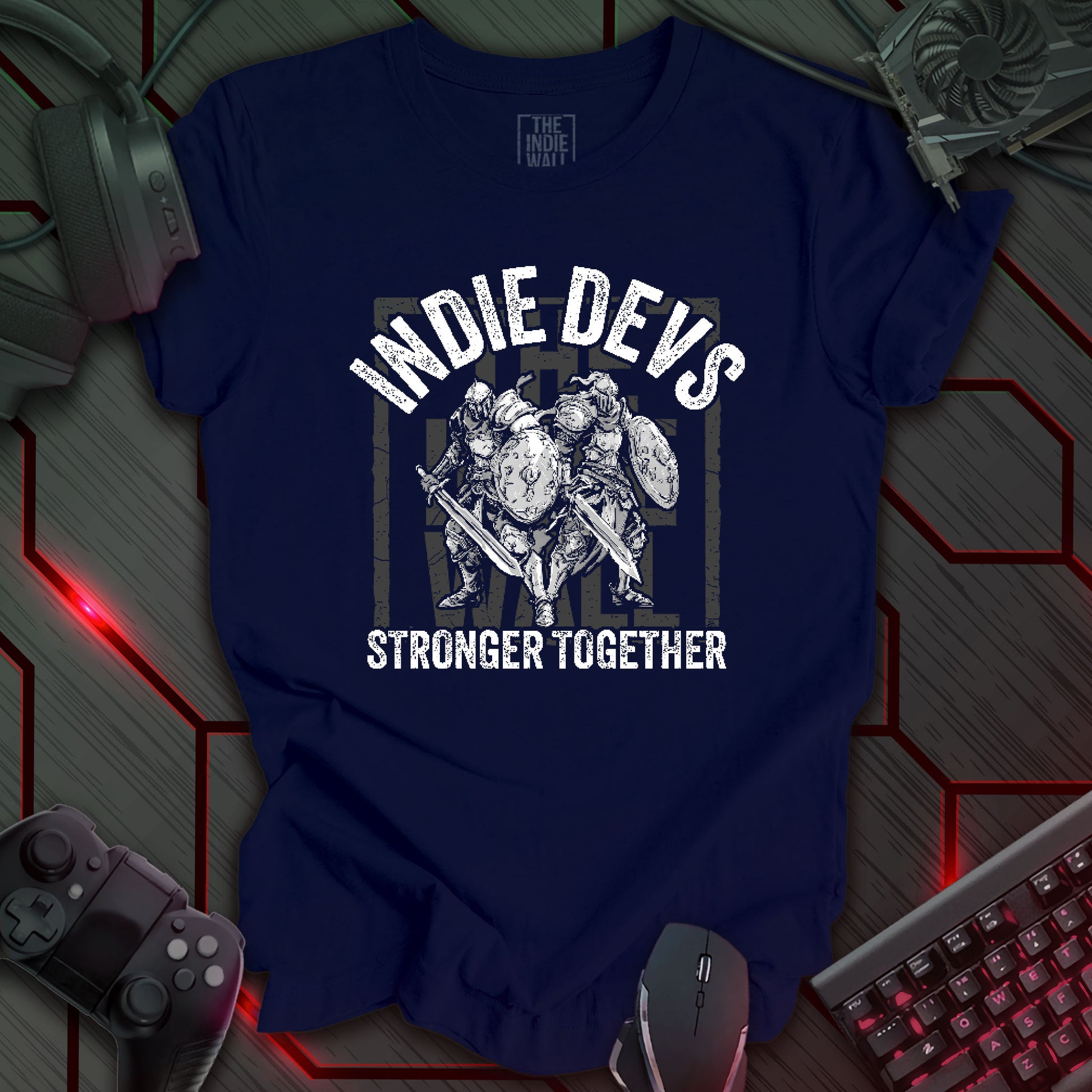 stylized black and white illustration of two armored fantasy warriors standing in front of a large faded Indie Wall brand logo. Bold distressed arched text above reads "INDIE DEVS". Bold text below the image reads "STRONGER TOGETHER". Navy blue background.