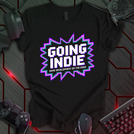 This t-shirt design, created for indie game developers, features the phrase 'GOING INDIE' in stylized, pixelated text with a jagged, colorful outline, and the tagline 'GAME DEVELOPMENT ON THE EDGE' below.  It's a bold design targeting those passionate about independent game creation.