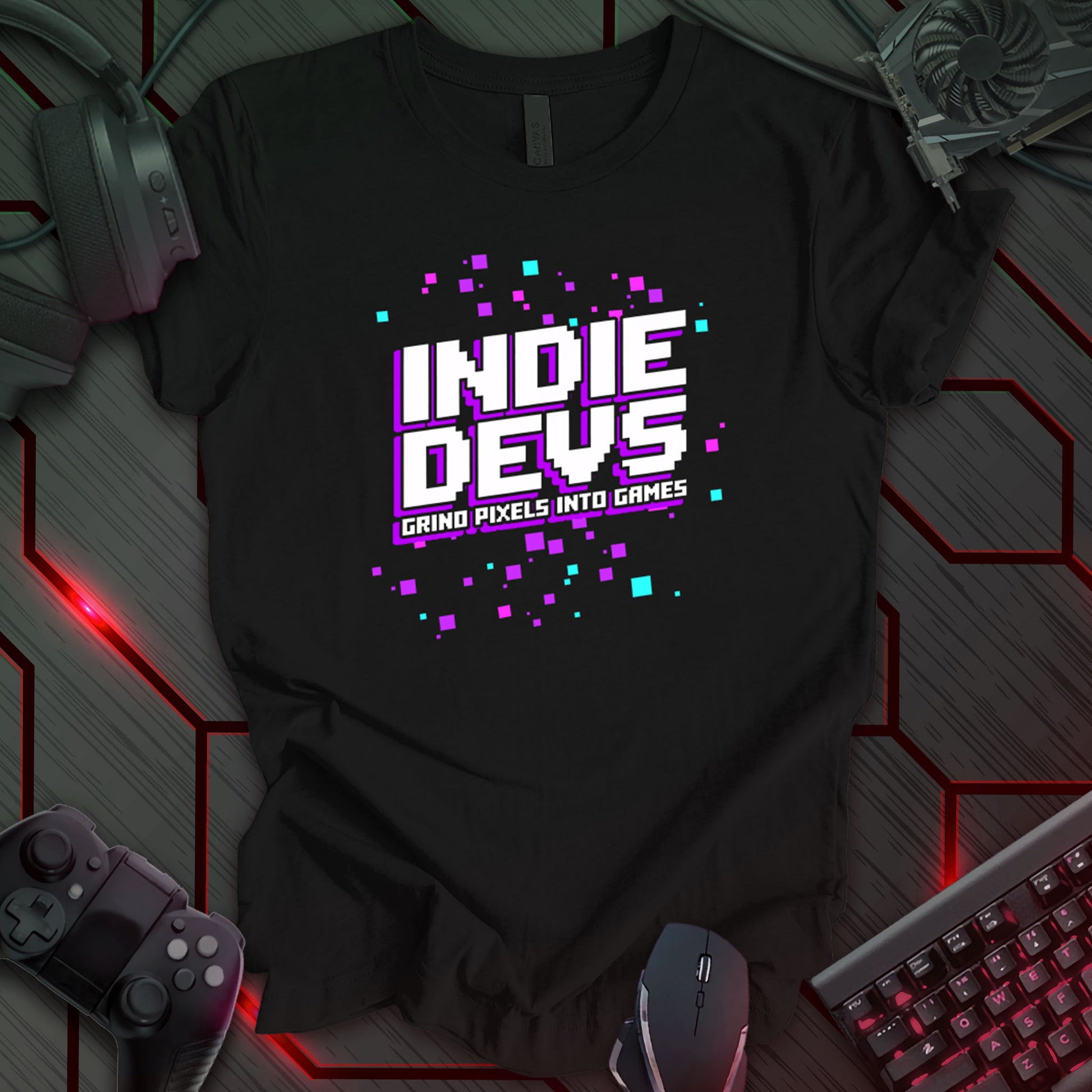 This t-shirt design, ideal for indie game developers, features pixelated text 'INDIE DEVS' in a gradient of pink and purple, with the phrase 'GRIND PIXELS INTO GAMES' below.  The design includes scattered pixel art squares in blue, pink, and purple, appealing to those in the independent game development community.