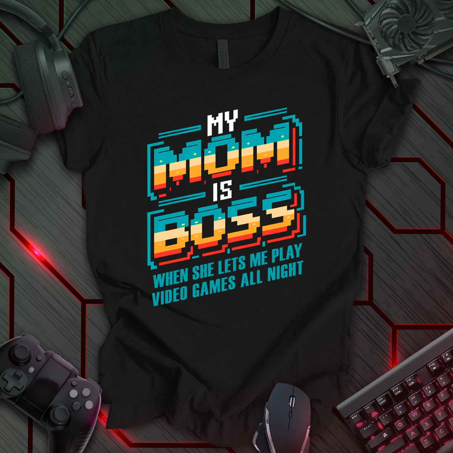 T-shirt design with pixelated text "MY MOM IS BOSS" in bold, colorful font on a black background. Includes "WHEN SHE LETS ME PLAY VIDEO GAMES ALL NIGHT" in smaller text below. Retro gaming style. Funny mom t-shirt for kids or teens. Ideal for casual wear or gifts. Keywords: gamer mom shirt, funny kid tee, video game t-shirt, pixel art clothing, gaming humor, teen gamer gift, mom appreciation shirt, retro gaming apparel.