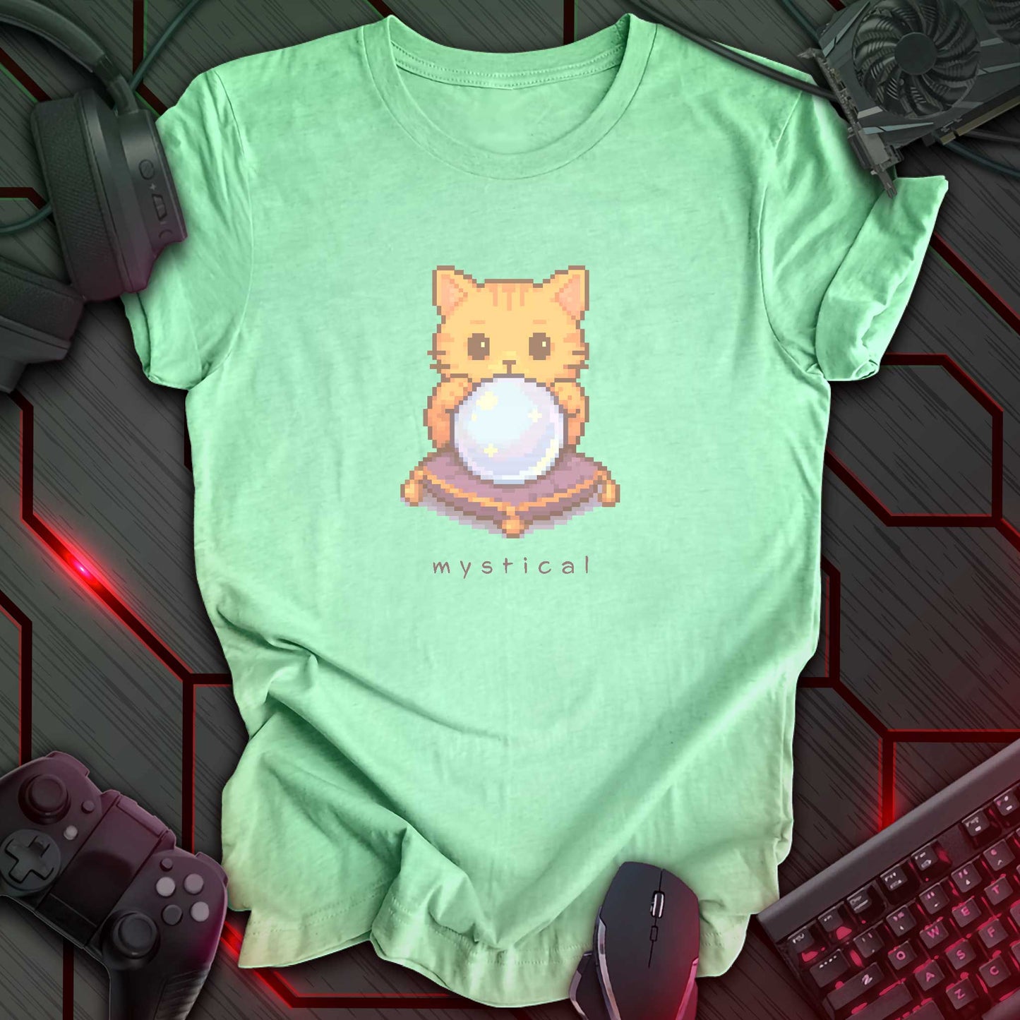 Pixel art orange cat holding glowing crystal ball with “Mystical” text underneath. Heather mint green background.