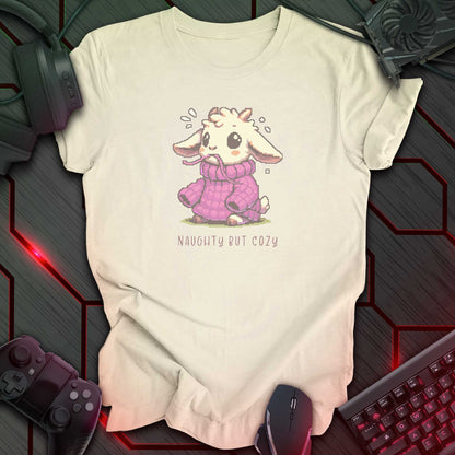 Pixel art goat in oversized purple sweater with “Naughty But Cozy” text underneath. Natural color background.
