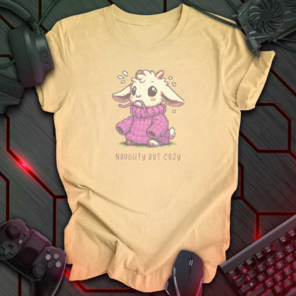 Pixel art goat in oversized purple sweater with “Naughty But Cozy” text underneath. Soft cream background.