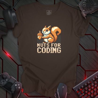 pixel art cute brown squirrel holding an acorn in front of lines of binary code. The words "NUTS FOR CODING" is written in a bold pixel art lettering.  Brown background.