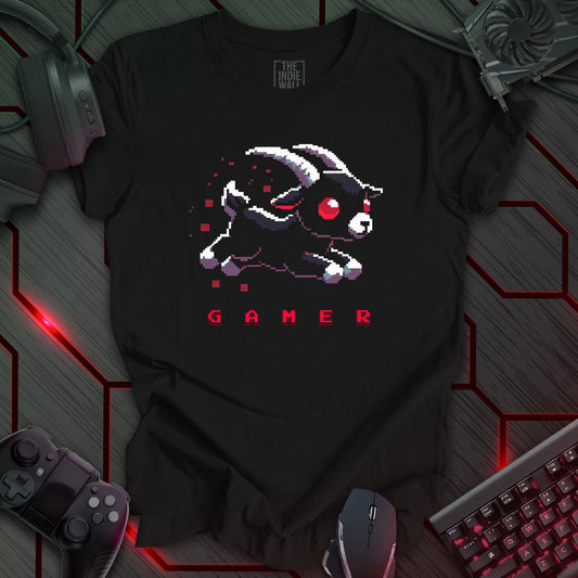 leaping pixel art black baby goat with large white horns, large red eyes trailed by red pixels. The single word "GAMER" written in a pixel art font beneath the image. Black background. 