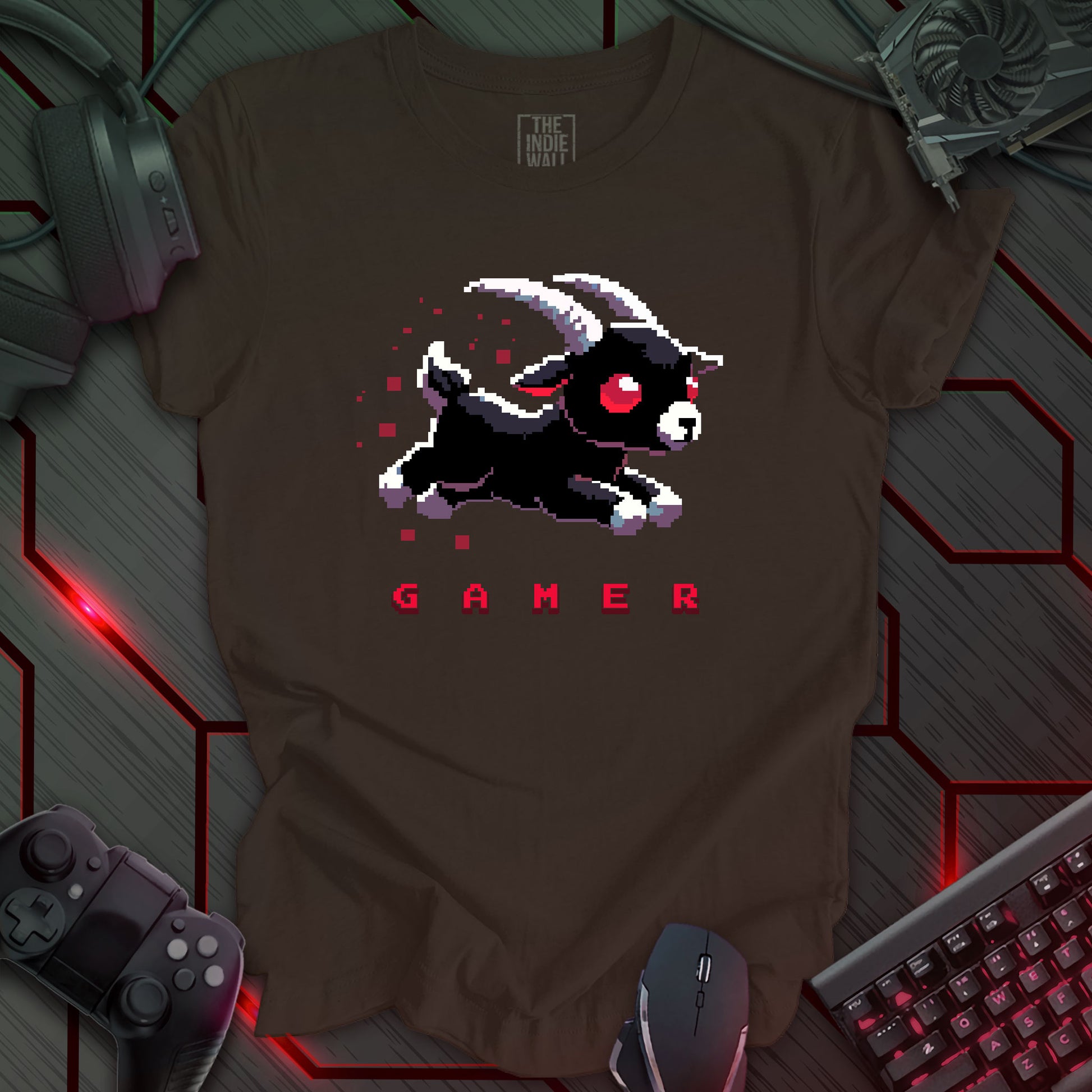 leaping pixel art black baby goat with large white horns, large red eyes trailed by red pixels. The single word "GAMER" written in a pixel art font beneath the image. Brown background. 