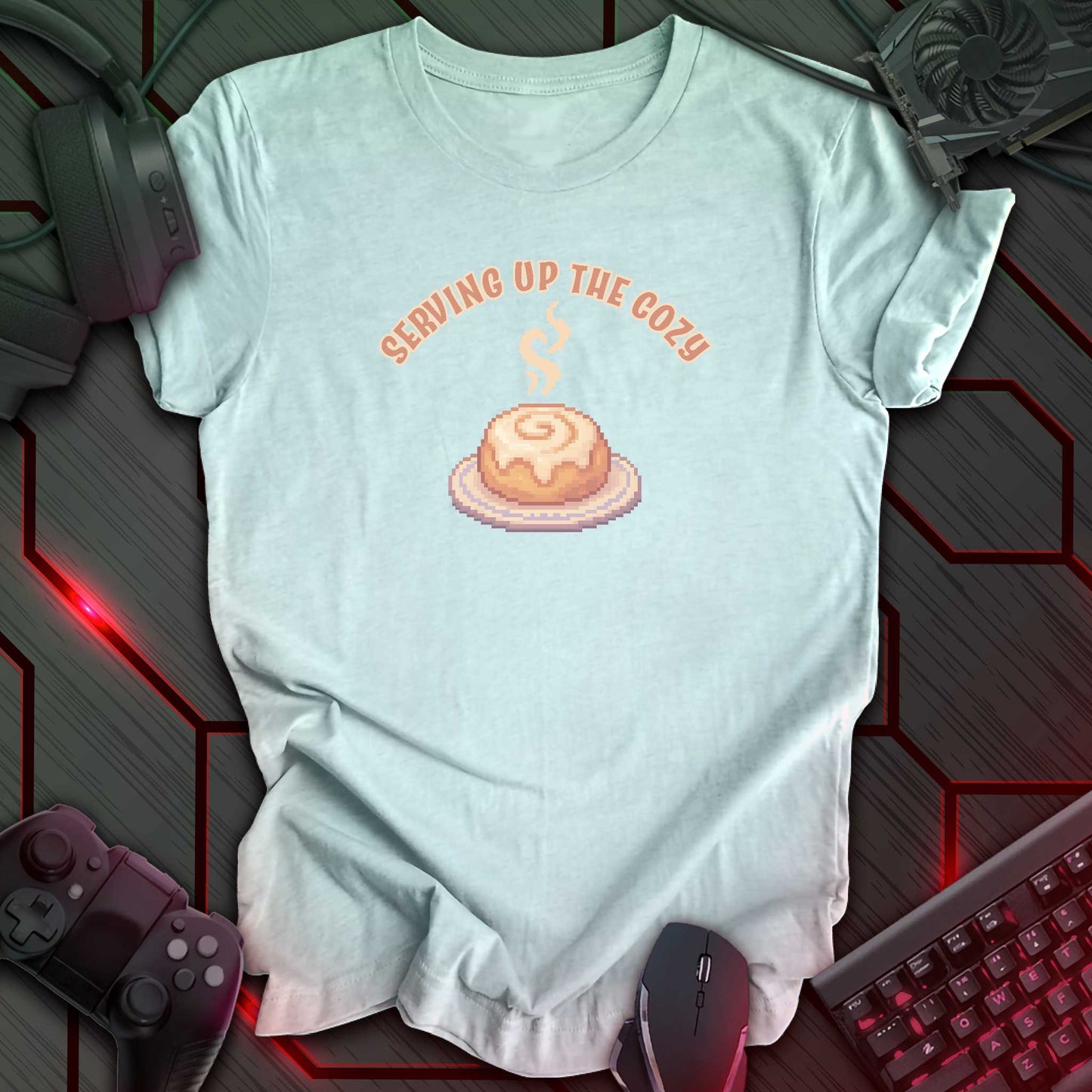 Pixel art cinnamon roll with steam on a plate under text “Serving Up the Cozy” in cozy gamer kawaii style. Heather Ice Blue background.