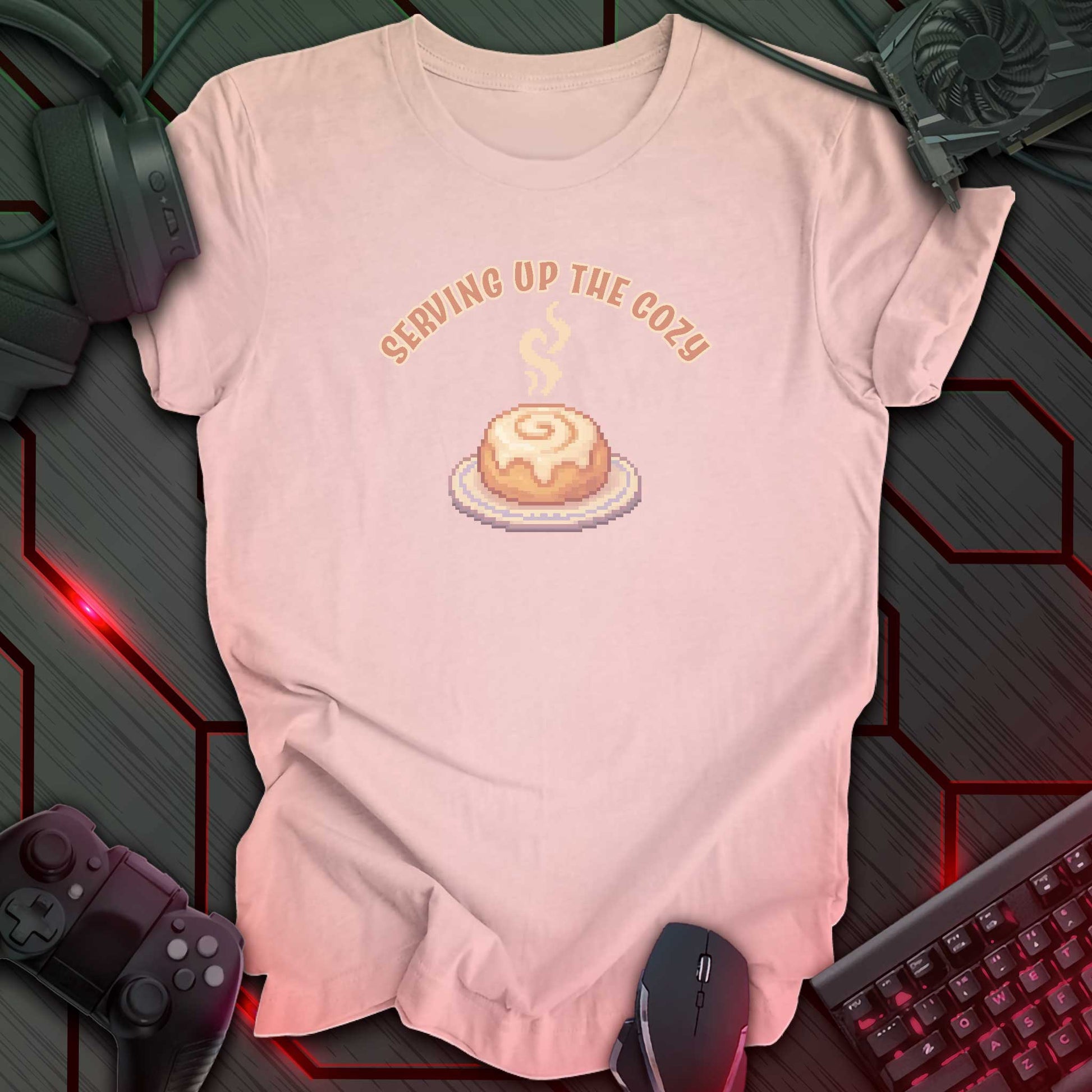 Pixel art cinnamon roll with steam on a plate under text “Serving Up the Cozy” in cozy gamer kawaii style. Soft Pink background.