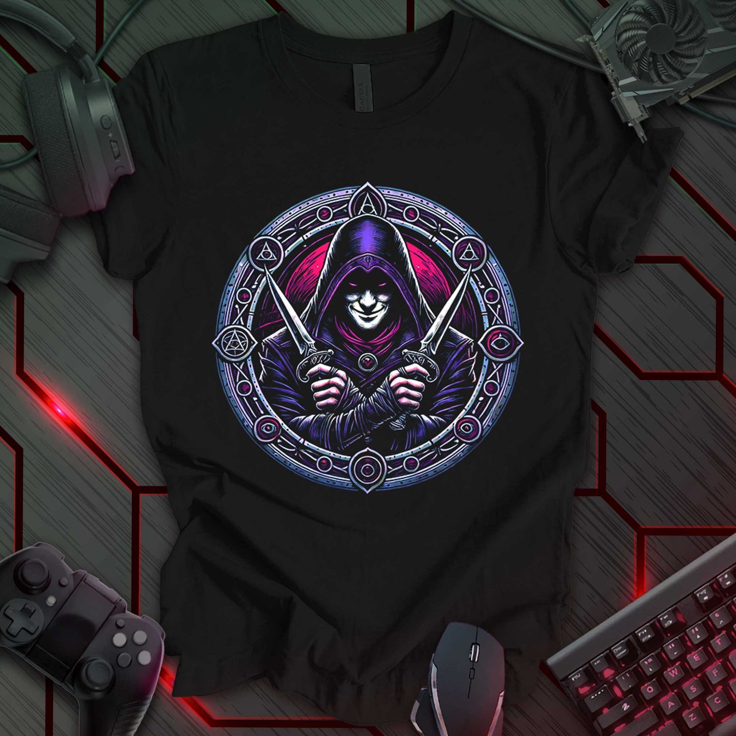 Black gaming t-shirt featuring a hooded assassin in deep red and purple tones, gripping dual daggers. The design is framed by an ornate circular border with arcane and cult-like symbols, perfect for medieval fantasy and RPG fans.